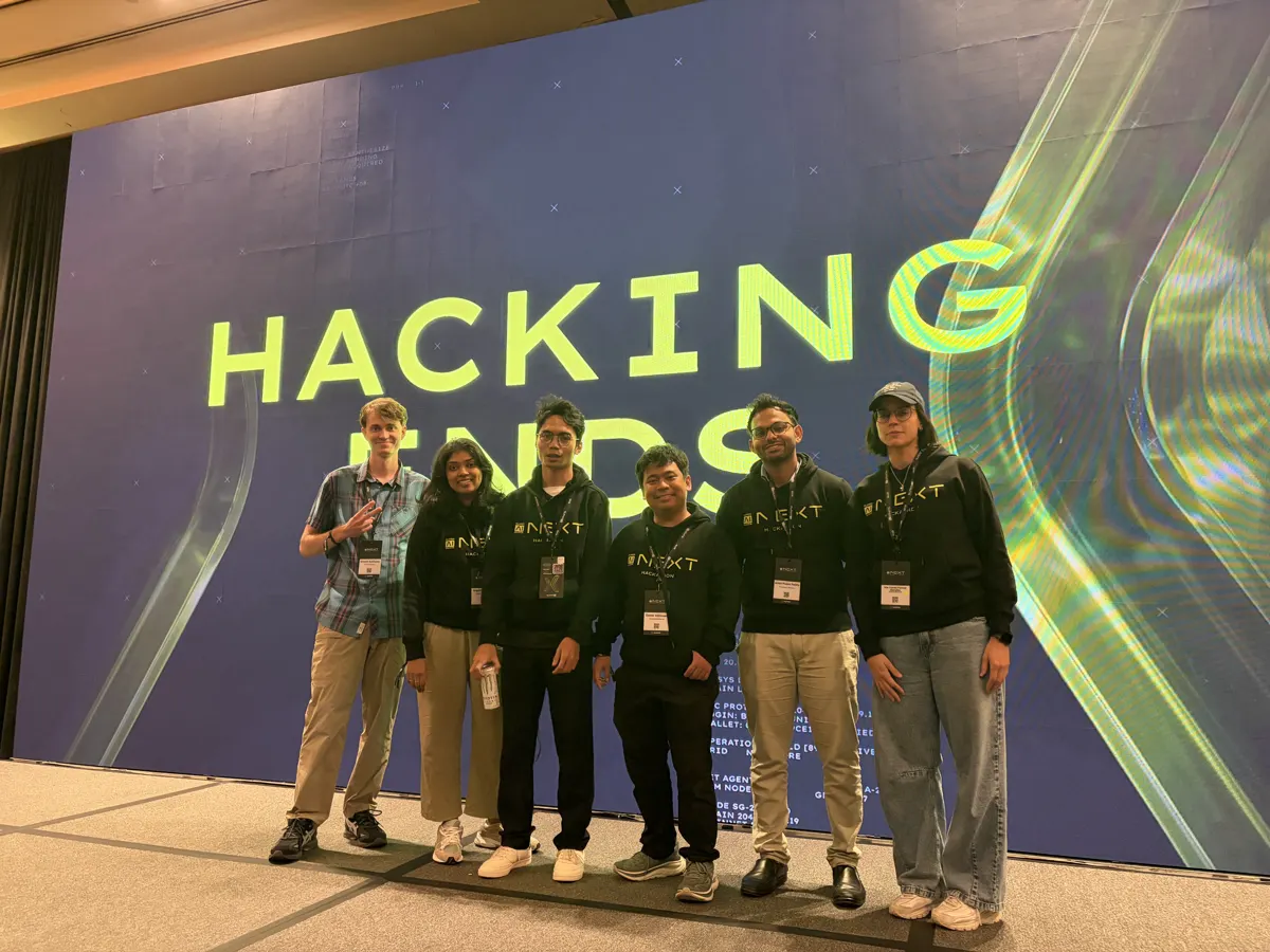 A team on stage at a hackathon