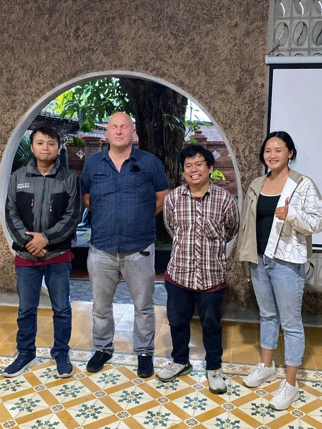 A team posing after the final pitch at Hackathon Jogja
