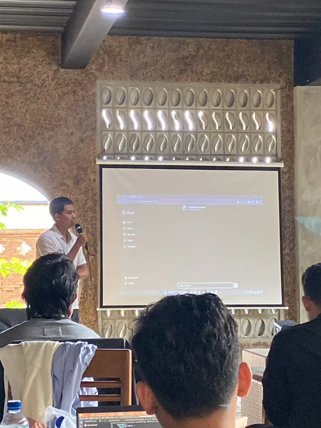 A participant presenting a live demo at Hackathon Jogja